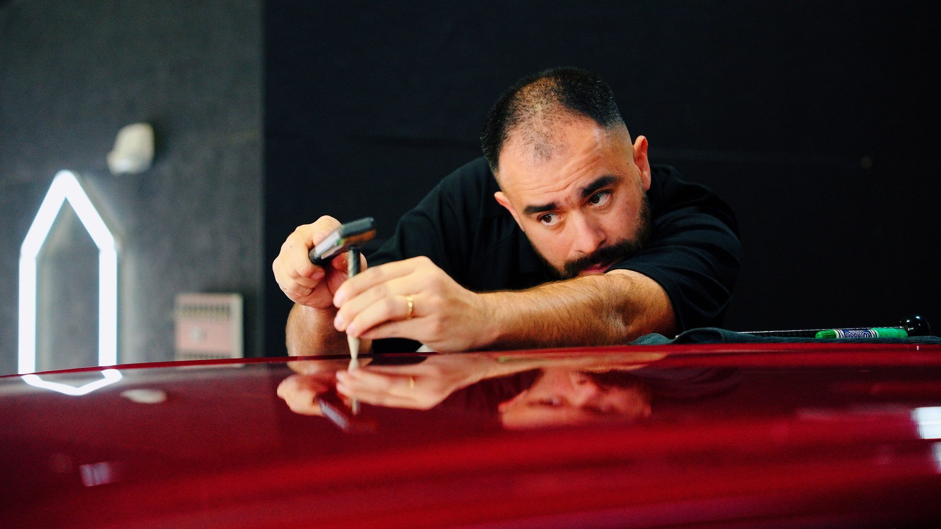 man working on car